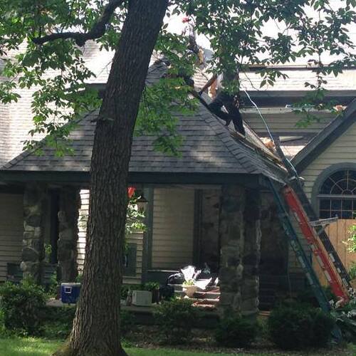 Roofers Work on Roof Repairs.