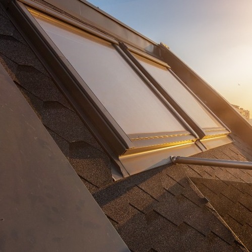 close-up of skylights on an asphalt shingle roof