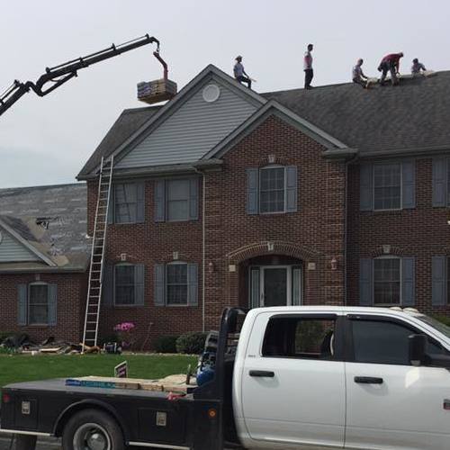 residential roofers on the top of a roof