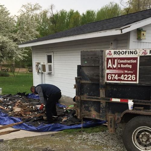 Roofers Clean Up After a Job.