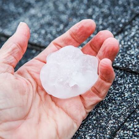 A Hailstone in a Person's Hand.